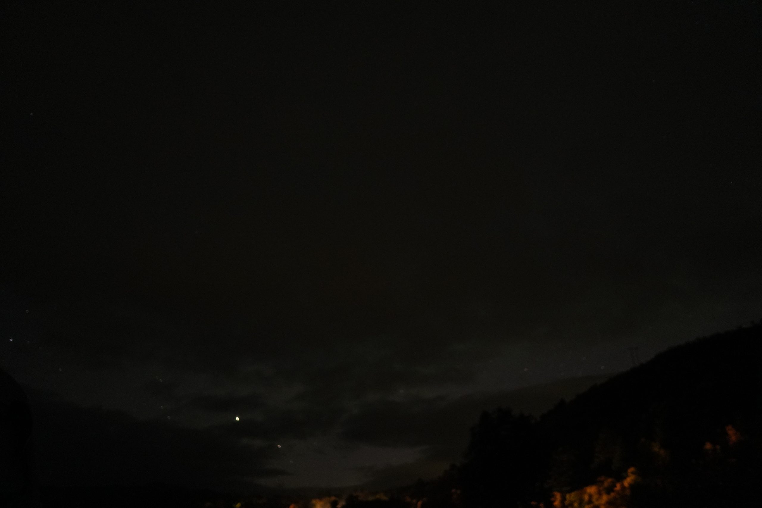 Night sky above a distant horizon
